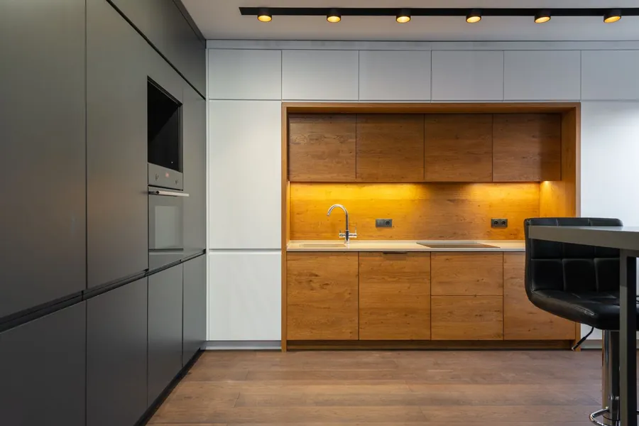 Handleless J pull kitchen cabinets with integrated lipped door edges in a Liverpool kitchen
