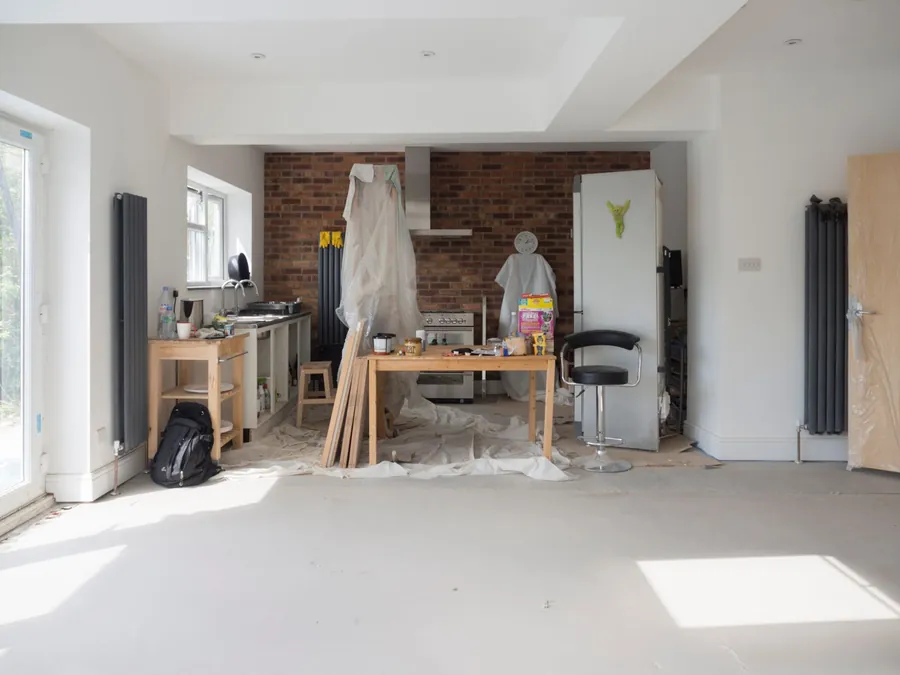 Original brick wall left exposed where a load bearing wall was opened up during a Liverpool kitchen knock through