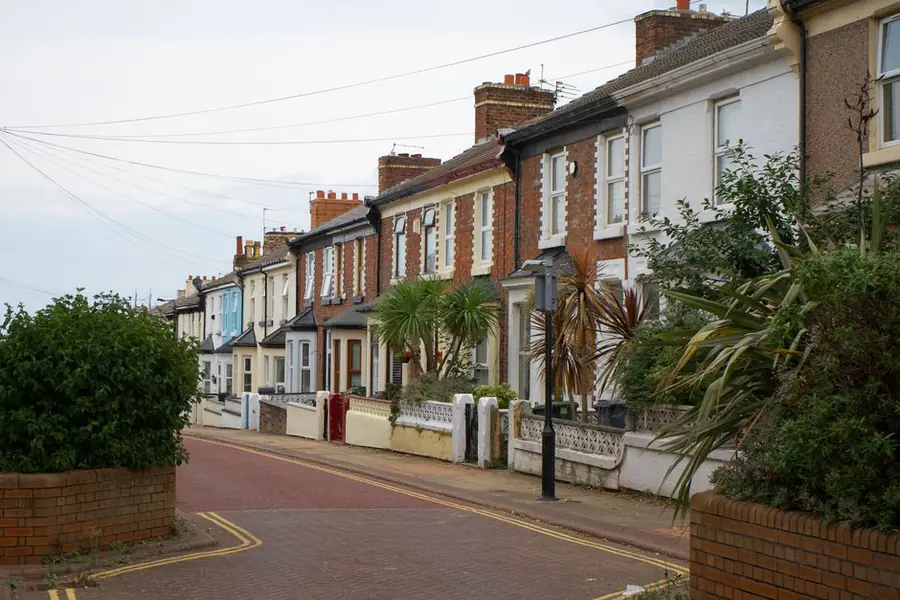Row of Victorian terraced houses on a Liverpool street where knock through kitchen projects are common