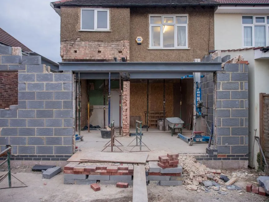 Steel beam installed over a newly formed opening during structural work on a UK home