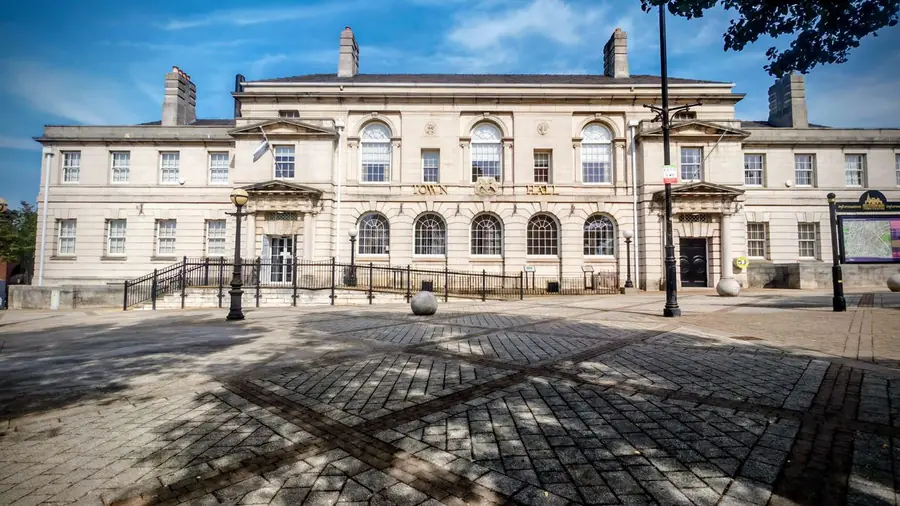 Stone fronted Victorian town hall of the kind that houses a council building control department, the route for notifiable kitchen work in Crosby and Waterloo
