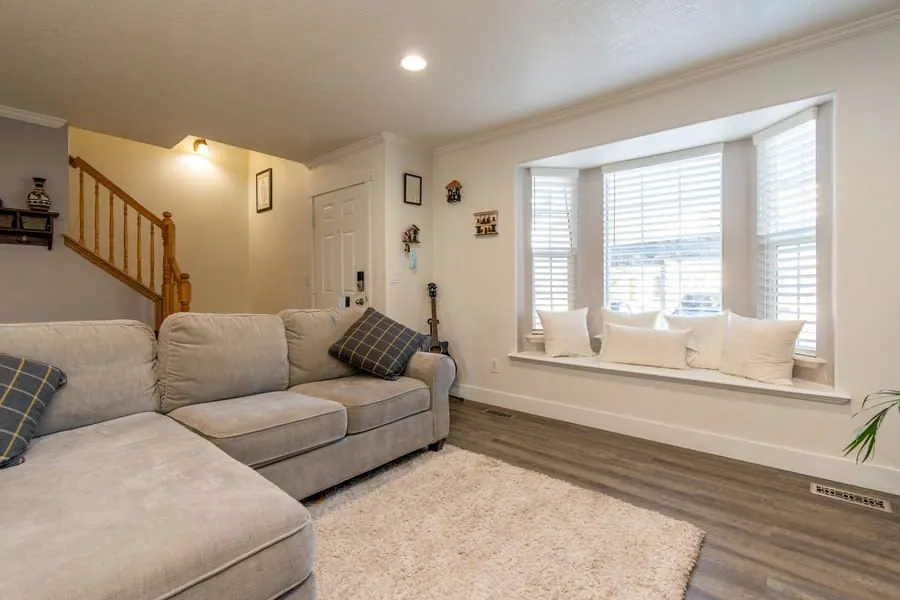 Living room bay window with a built-in window seat and cushions