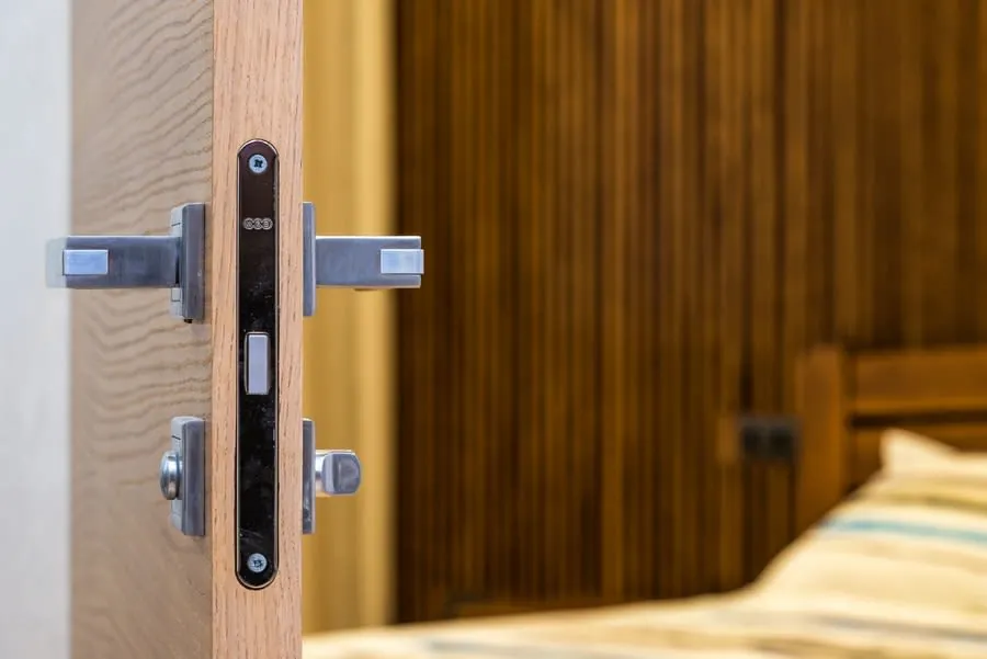 Open bedroom doorway with a plain internal door and handle