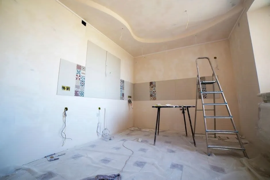 Kitchen fitting quotes and paperwork spread out on a worktop in a Liverpool home