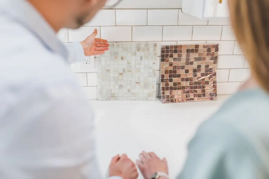 Couple comparing material samples while planning a kitchen update