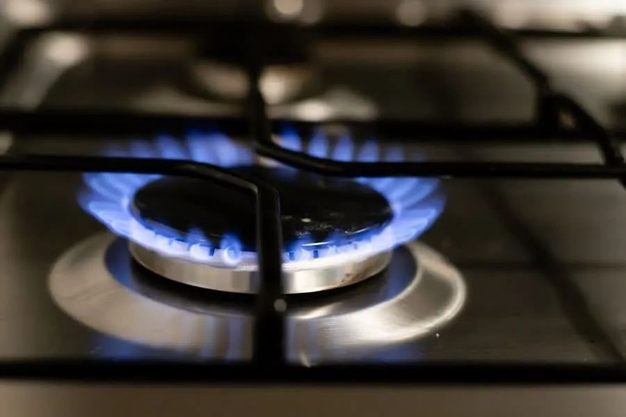 Blue flame burning on a gas hob ring that has been connected to a rerouted supply