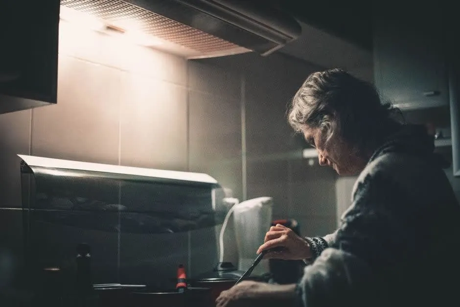 Cooking on a hob beneath a cooker hood in a Liverpool kitchen