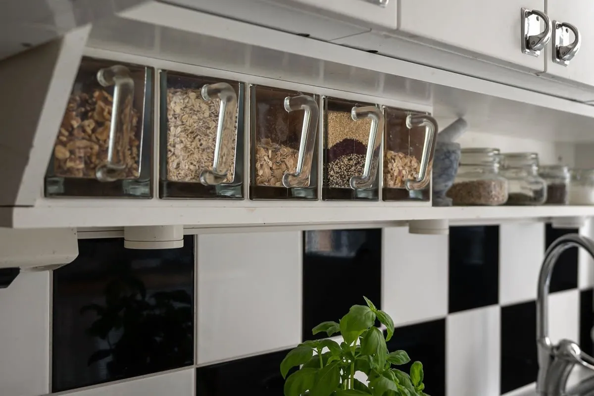 Kitchen shelving with labelled storage jars in a Warrington home