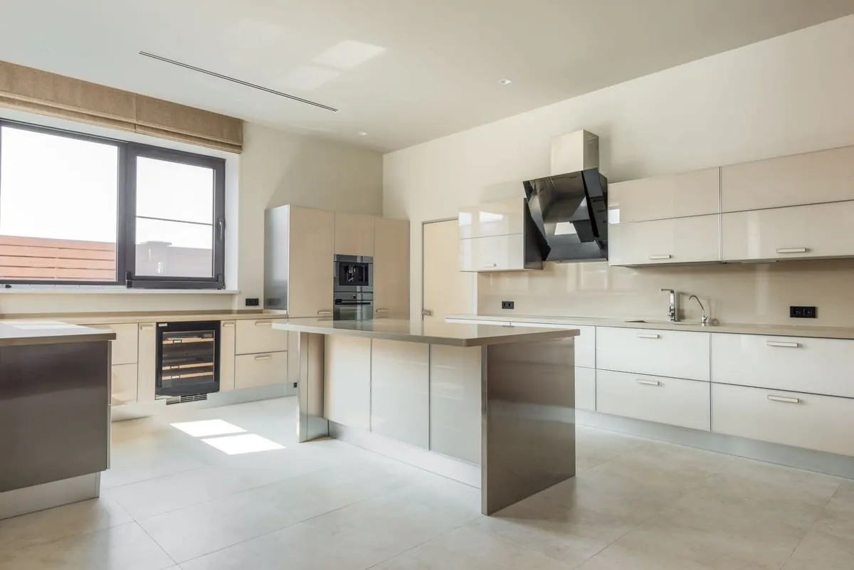 Kitchen worktop and island with cabinets and a large window in a Liverpool home