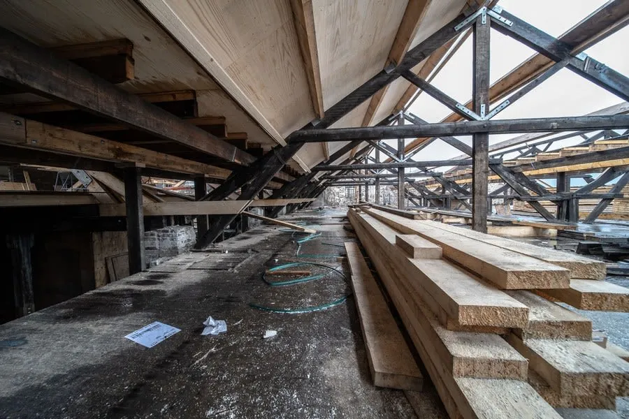 Timber roof beams and rafters inside a loft space under construction