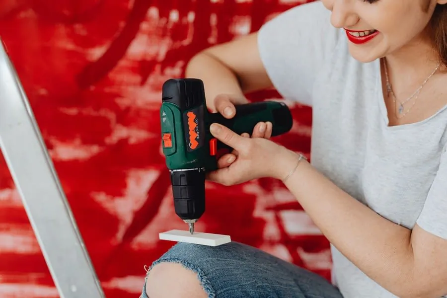 Person using a cordless drill during a home renovation project