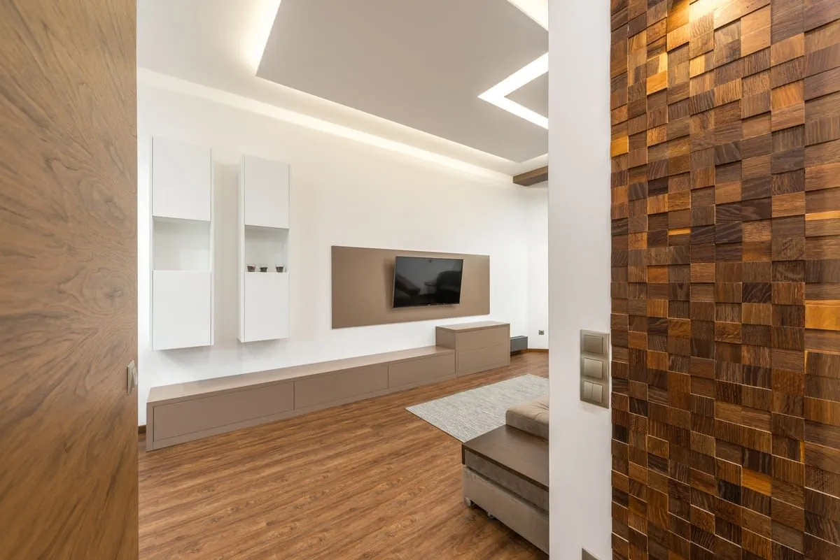 Modern Liverpool living room with a wall-mounted TV and warm wooden panelling