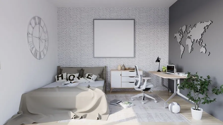 Bright bedroom with a fitted desk workspace along one wall and a bed opposite