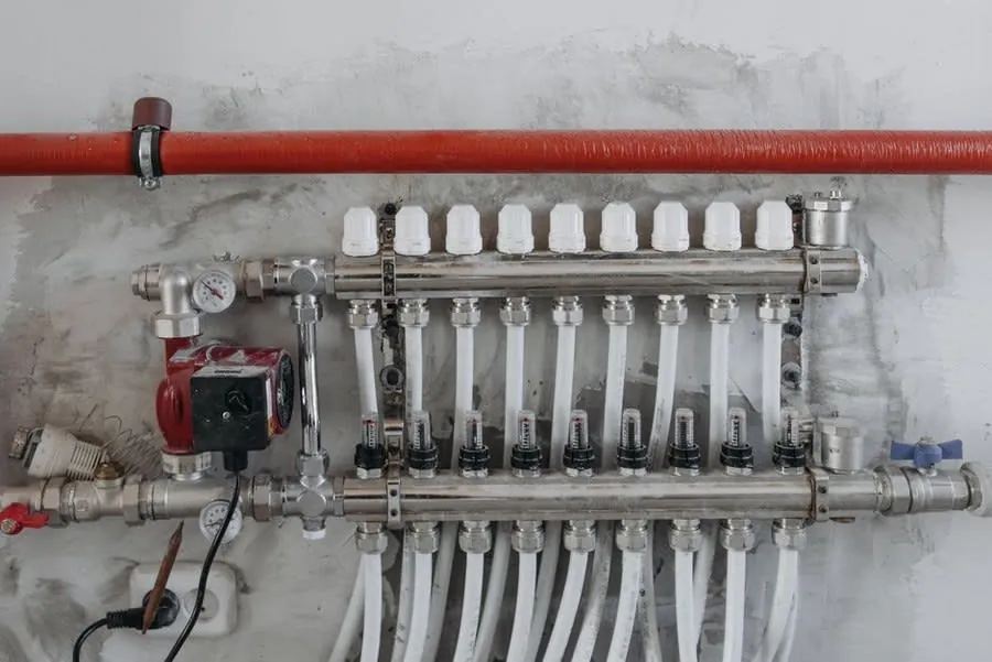 Heating manifold and pipework serving underfloor heating in a Liverpool kitchen