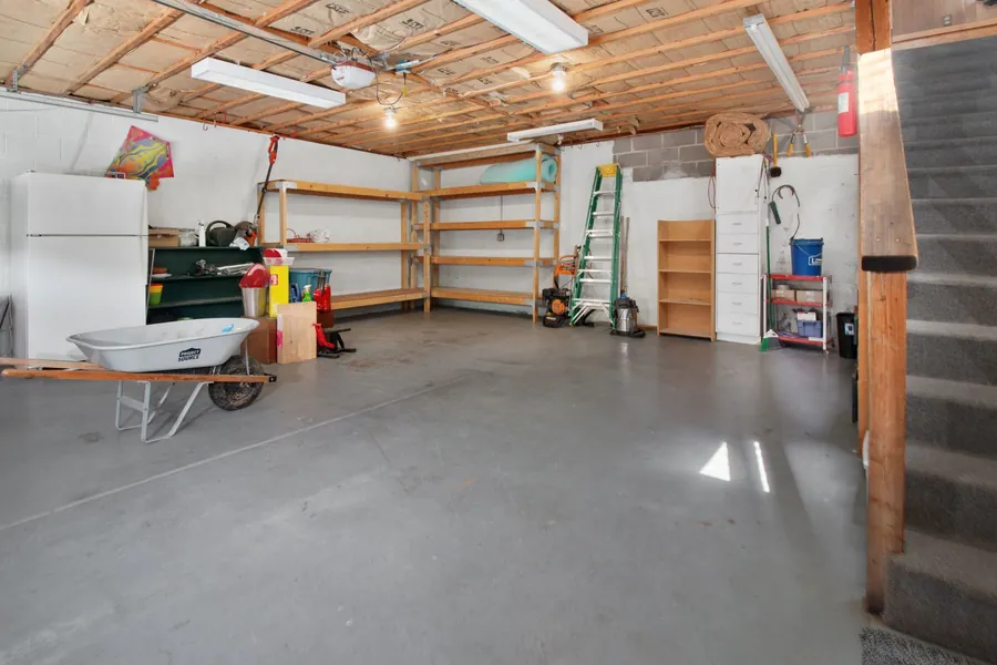 Garage interior with storage and tools before conversion to a utility room in a Liverpool semi-detached house