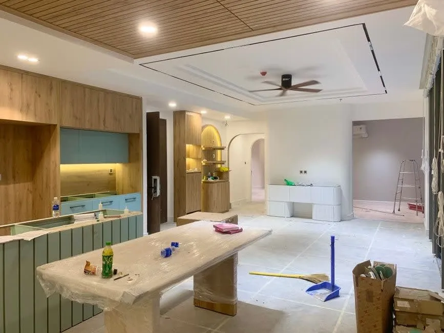 Kitchen units part-installed during a renovation, showing the cabinet boxes before doors go on