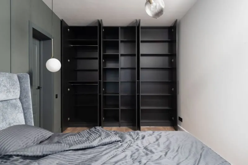 Contemporary built-in wardrobes with dark door panels