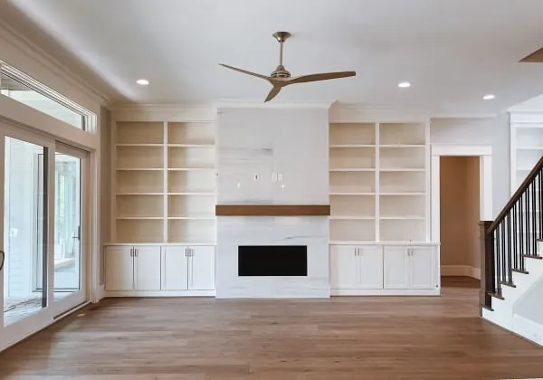 Living room with built-in custom cabinets and shelving