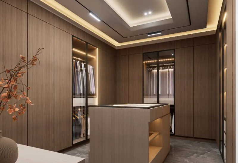 Fitted dressing room with warm lighting and wood-finish wardrobes