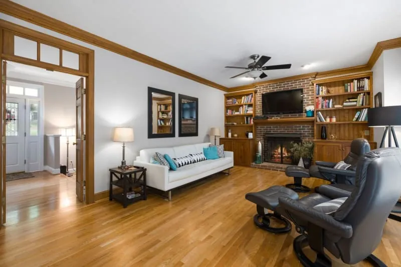 Fitted bookshelves and fireplace in a warm living room