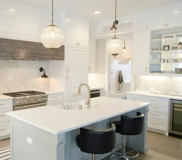 Large fitted kitchen with a painted island of the kind installed in Blundellsands and Crosby homes