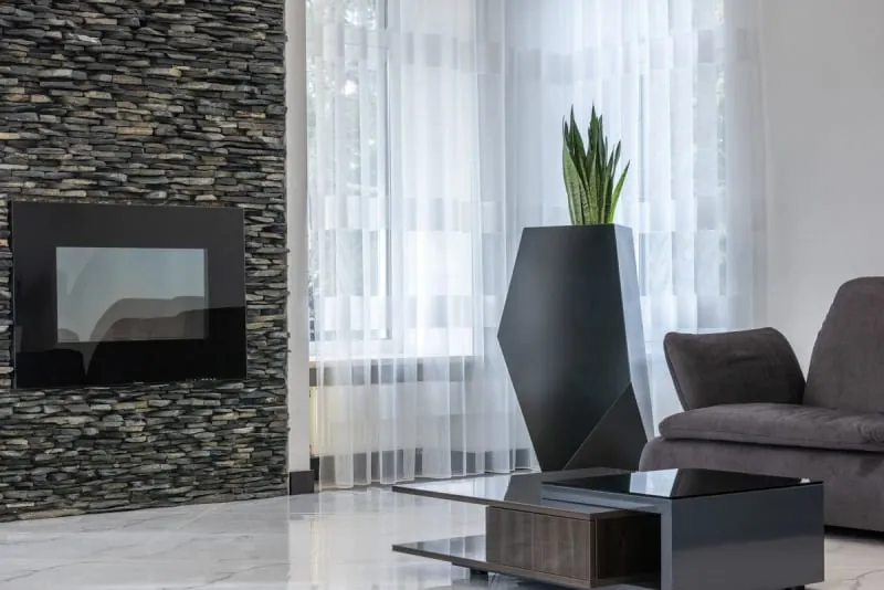 Media wall with inset electric fireplace in a modern living room