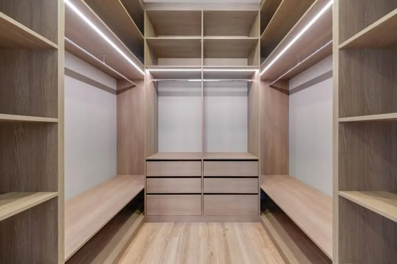 Walk-in wardrobe shelving with LED strip lighting