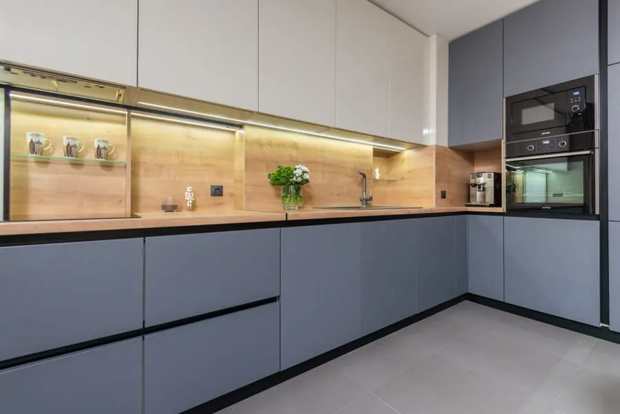 Kitchen fitter installing units in a Merseyside home