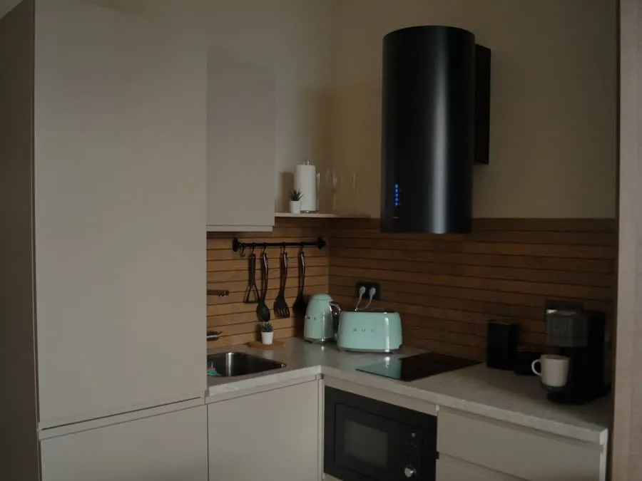 Kitchen fitter going through plans in a Merseyside home